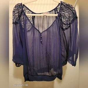 Sheer Navy Blouse with Lace Accents.